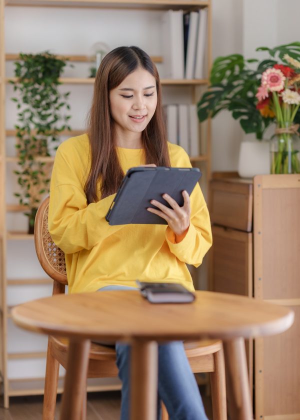 beautiful-asian-business-woman-working-at-home-using-digital-tablet-with-peace-of-mind-.jpg